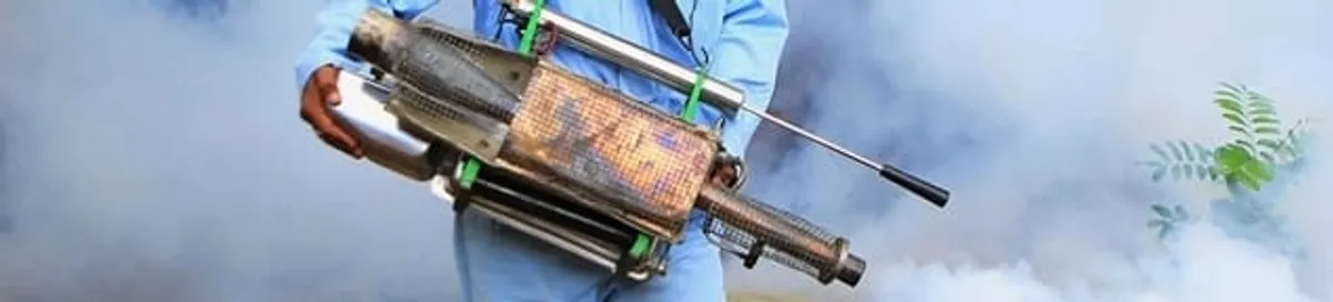 Fumigation technician using a fogger for deep pest treatment in Anaheim, CA